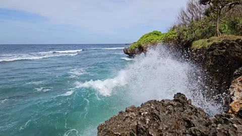 Waves crash on the rocks on the beautiful Nusa Dua beach. Bali, Indonesia. Stock Footage 280186401