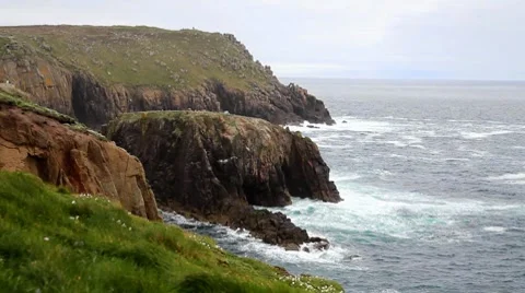 Waves crash onto rocks at Land's End (Cornwall, England) Stock Footage 7753449