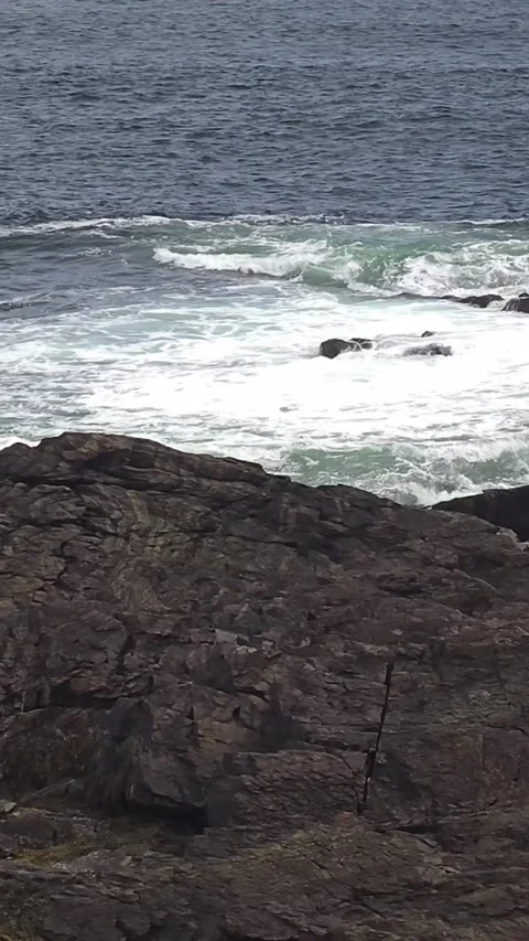 Waves crash on rocks at Marginal Way Ogunquit, Maine Stock Footage 336532258