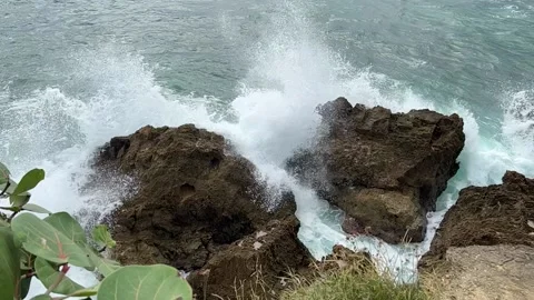Waves crash on rocks in slow motion Stock Footage 165083034