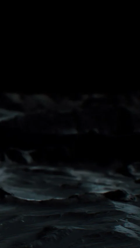 Waves crash on rocks under the night sky at a coastal location 스톡 동영상 344959359