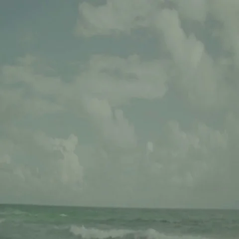 Waves Crash on Rocky Beach During Storm Stock Footage 69699432