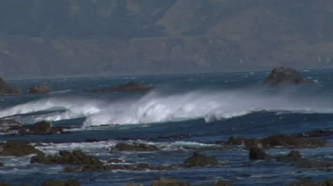 Waves crash on a rocky shore Stock Footage 8680854