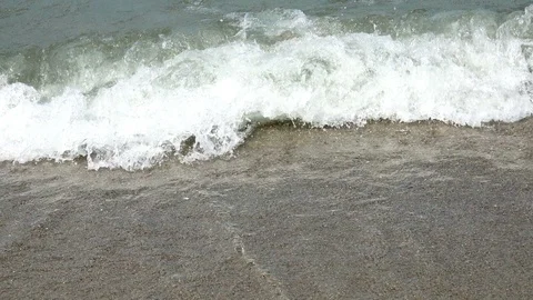 Waves crash on the sandy shore, green, dirty water Stock Footage 88322785