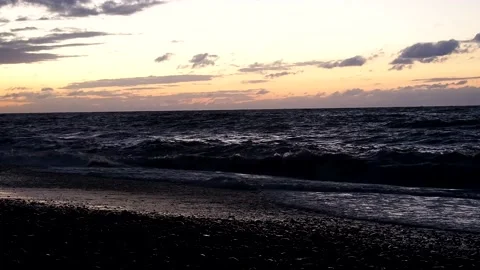 Waves crash on the shore. Sunset on the seashore. Velvet season.   sea coast. Stock Footage 220690881