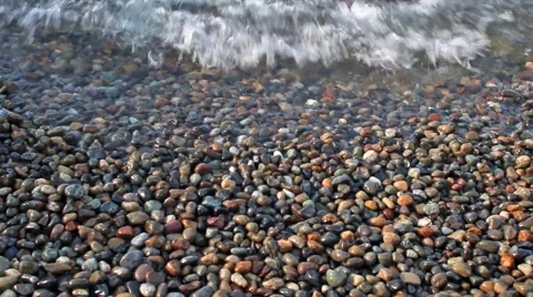 Waves crash on small rocks Seattle Washington Sound Still Video stock 58628757