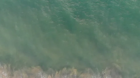 Waves Crash into Surf from Above Stock Footage 101450377
