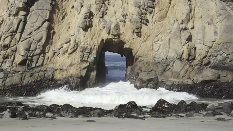 Waves Crash Through Rock Formation Stock Footage 101016192