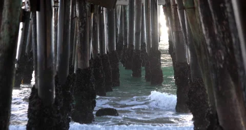 Waves Crash Under Pier With Sunlight Stock Footage 232543753
