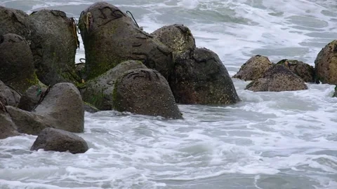 Waves crash on waves breaker Stock Footage 152012376