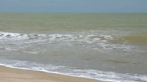 Waves crashed onto the sandy beach on South China Sea Stock Footage 231760668