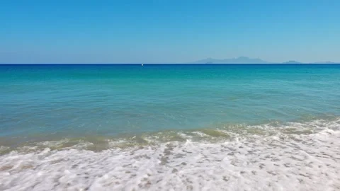 Waves crashes on Kos island beach in Aegean Sea with stereo sound Stock Footage 312957500
