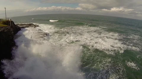 Waves crashing against cliff Stock Footage 40392003