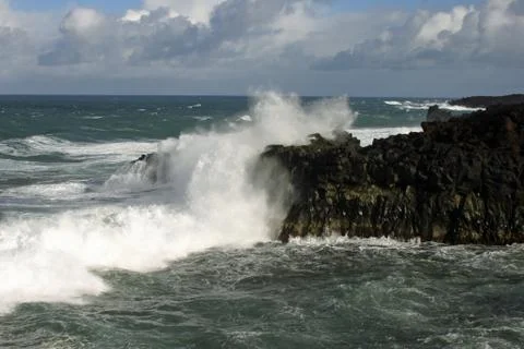 Waves crashing against cliffs Stock Photos
