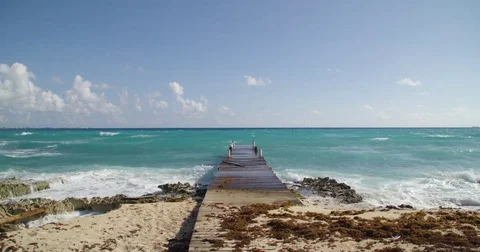 Waves crashing against a dock in the Caribbean Stock Footage 80272264