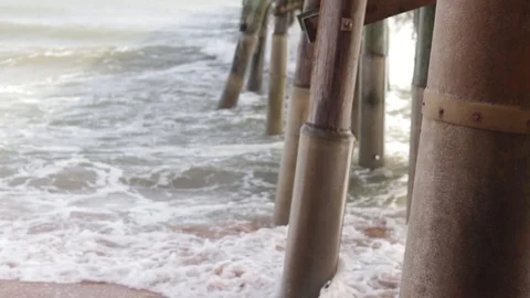 Waves Crashing Against A Pier Stock Footage
