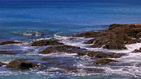Waves crashing against rock on the reef shore.Fierce, tumbling wave view. Stock Footage 280143885