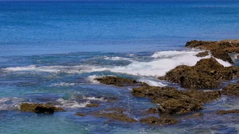 Waves crashing against rock on the reef shore.Fierce, tumbling wave view. Stock Footage 280143890