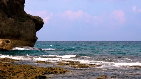 Waves crashing against rock on the reef shore.Fierce, tumbling wave view. Stock Footage 280143964
