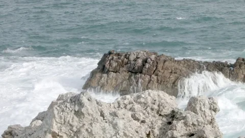 Waves crashing against the rocks  Stock Footage 76436457