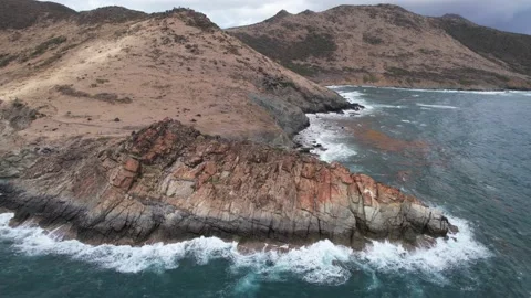 Waves crashing against rocks Stock Footage 237816338