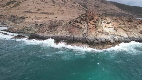 Waves crashing against rocks Stock Footage 237816353