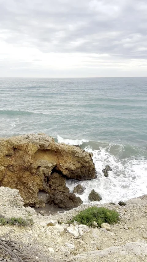 Waves crashing against the rocks Stock Footage 311511980