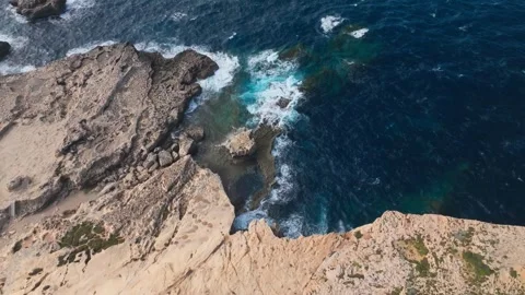 Waves Crashing Against Rocky Cliffs on Malta Coastline with Copy Space 스톡 동영상 340554377