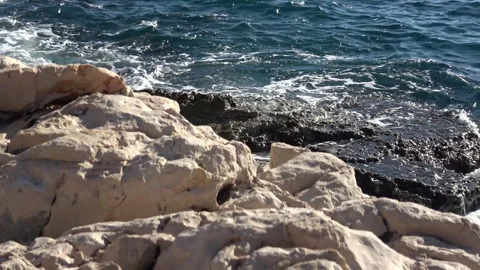 Waves crashing against sharp limestone rocks along the coast 2 Video stock 342394300