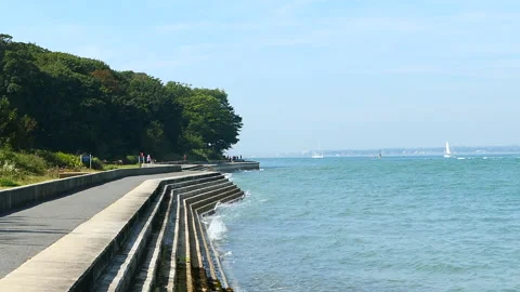 Waves crashing against steps Stock Footage 244866617
