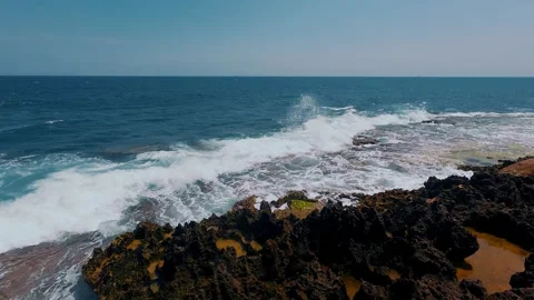 Waves Crashing on Ancient Million-Year-Old Fossil Red Coral Reef Stock Footage 337583145