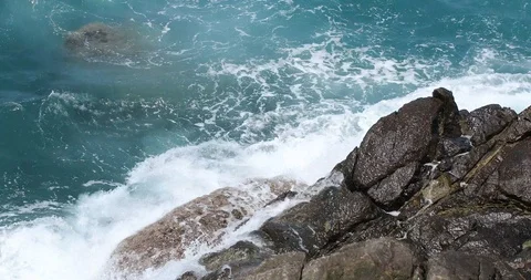 Waves crashing and hitting on the rocks at the ocean or sea. Stock Footage 101011814