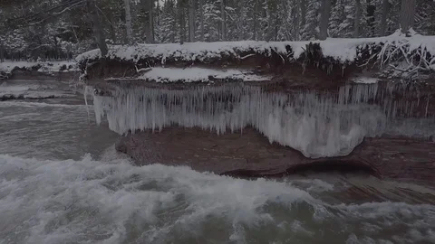 Waves crashing and icicles in slow motion Stock Footage 86548870