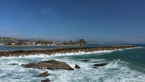 Waves crashing at barrier Stockbeeldmateriaal 114476727
