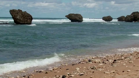 Waves crashing on the Bathsheba beach with boulders on east coast of Barbados Stock Footage 75419082