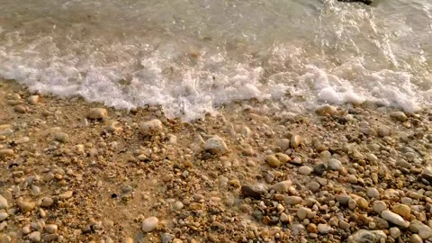 Waves crashing on the beach in the afternoon Stock Footage 274725497