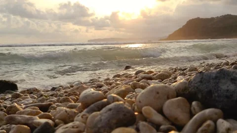 Waves crashing on the beach in the afternoon Stock Footage 274726624