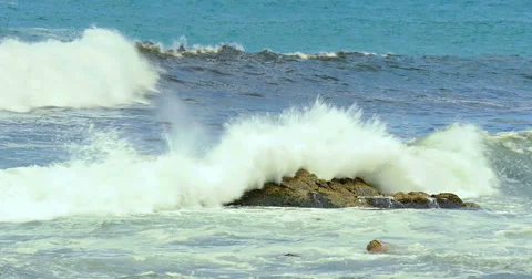 Waves crashing onto the beach and rocks Stock Footage 53836053