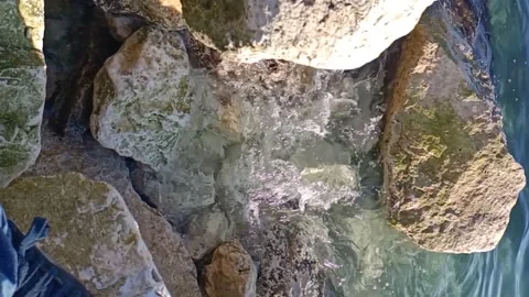 Waves crashing on the beach on a cold day Stock Footage 168939554