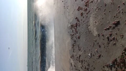 Waves crashing on the beach on a cold day Stock Footage 168961124