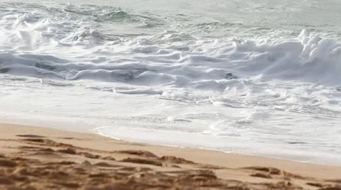 Waves crashing on beach Stock Footage 14811939