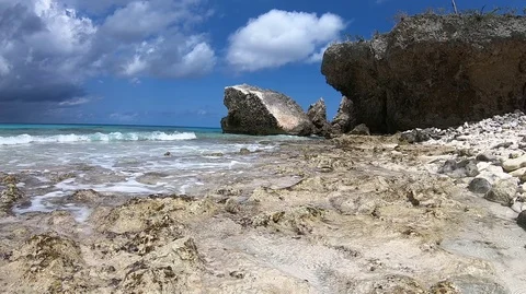 Waves crashing on beach Stock Footage 87909596
