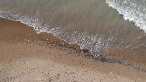 Waves crashing on beach Stock Footage 91780176