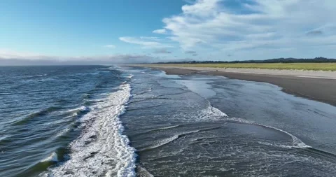 Waves crashing on the beach Stock Footage 247849329