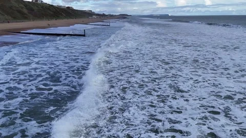 Waves crashing on beach Stock Footage 266163748
