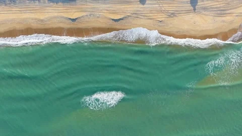 Waves Crashing Onto A Beach Stock Footage 329257705