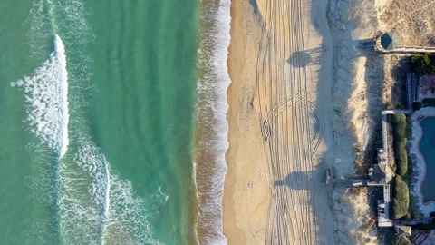 Waves Crashing Onto A Beach Stock Footage 329257727