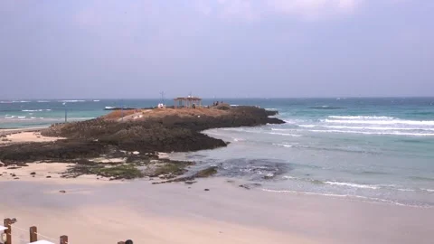 Waves crashing on a beach Stock Footage 332142316