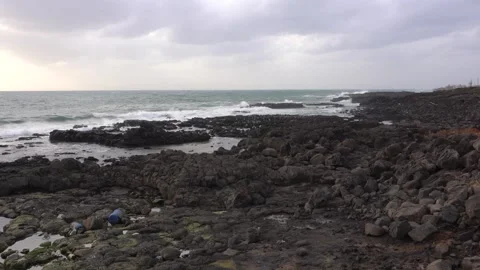 Waves crashing on a beach Stock Footage 332142328