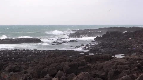 Waves crashing on a beach Stock Footage 332142337